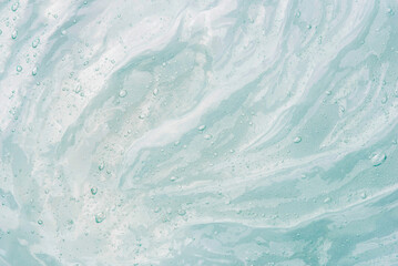 Transparent gel texture on a white background.