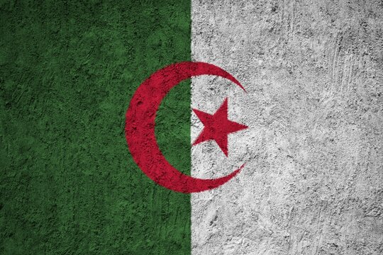 Algeria flag painted on the cracked grunge concrete wall