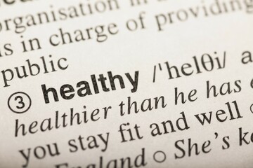 Healthy, word in dictionary. macro shot. selective focus