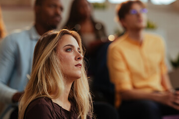 Fototapeta premium Businesswoman listening attentively during a conference meeting