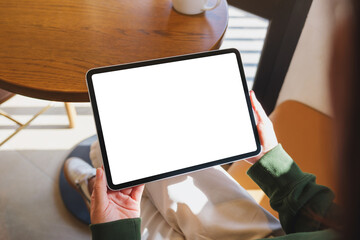 Mockup image of a woman holding digital tablet with blank desktop screen