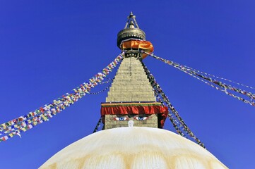 Boudhanath Stupa, UNESCO World Heritage Site, painted eyes, colorful prayer flags, Tibetan...