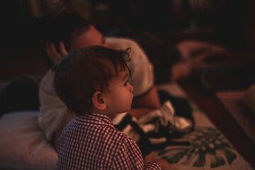 dreamy image of baby and mother in evening outdoors festival