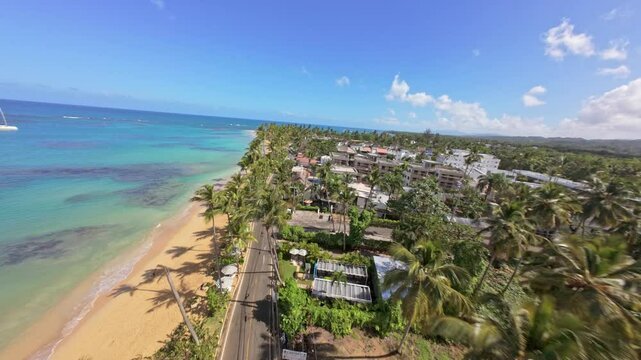 FPV flight at Punta Popy Beach, Las Terrenas: Coconut trees, golden sand, and turquoise waters