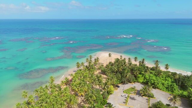 Stunning view of Punta Popy Beach, Las Terrenas, with crystal-clear waters, golden sands, and a tropical landscape reflecting the beauty of the Caribbean