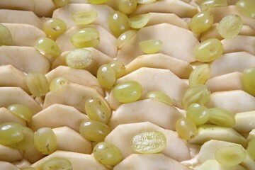 Apple slices and grapes on the dough, apple and grape slice