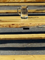 Empty beer mug on a table in a beer garden