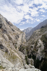 The mountain range is covered in snow and the sky is clear. The view is breathtaking and serene