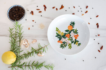 Top view of flower ceramic plate empty with mediterranean ingredients