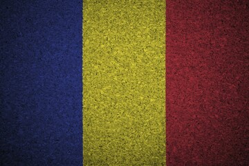 Fototapeta premium The Romania flag painted on a cork board