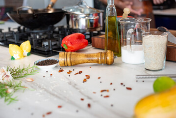 olive oil in a kitchen table with a shaker woody pepper