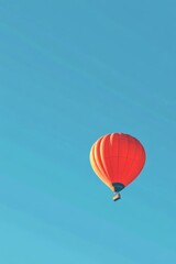 Fototapeta premium Stunning Hot Air Balloon Soaring in Azure Sky