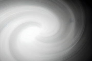 Abstract Swirling Gray Background Creates Dynamic Visual with Subtle Lines and Soft Gradients.