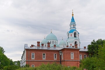  Valaam Island, Russia, July 12, 2024. Monastery wall and temple domes.                              