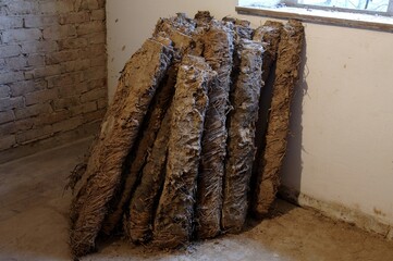 Old loam bundles used for attic insulation, at a farm estate built in 1922