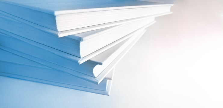 Shallow and soft focus against macro view of stack of books. Copy space. Useful banner design