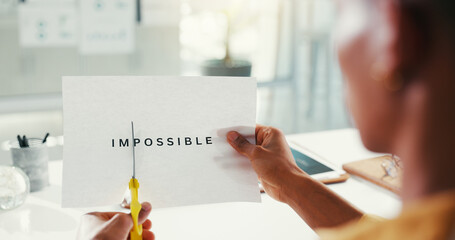 Business, hands and cutting paper with impossible for positive message, motivation and change quote. Professional, person and transform text for resilience, inspiration and resolution with belief