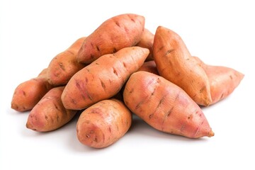 A bunch of deep orange sweet potatoes arranged in a pyramid-like formation, their rough, earthy skins in contrast with the smooth white background.