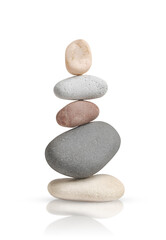 tower of smooth beautiful pebbles is isolated on a white background