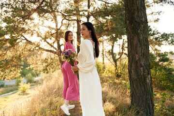 Naklejka premium Having a walk. Lovely lesbian couple are together outdoors in nature