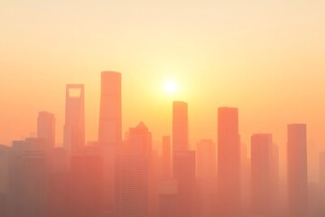Fototapeta premium A hazy skyline at sunrise, featuring tall skyscrapers silhouetted against a warm, orange sky.