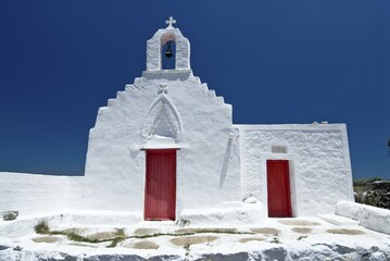Small Greek Orthodox chapel with a little forecourt and a red wooden door, Mykonos, Cyclades, Greece, Europe © Gerhard Zwerger-Schoner/imageBROKER