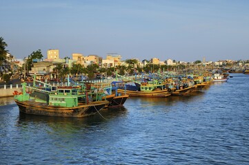 Colorful wooden fishing boats in the port of Phan Thiet, Vietnam, Asia