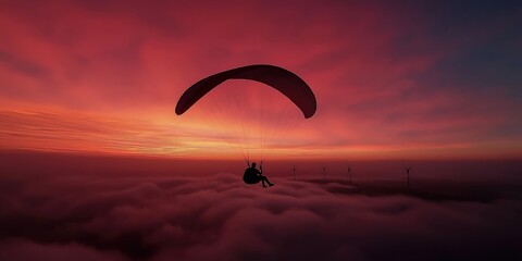 A breathtaking shot of a lone paraglider soaring gracefully through the sky at golden hour