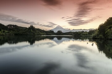 Currently inactive volcano, Mt. Egmont, Mt. Taranaki, reflection in the reservoir of Lake...