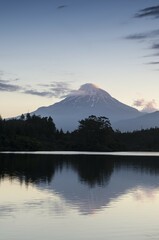 Currently inactive volcano, Mt. Egmont, Mt. Taranaki, reflection in the reservoir of Lake Mangamahoe, North Island, New Zealand, Oceania