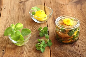 Homemade syrup made from fresh leaves of Plectranthus (Coleus) amboinicus, lemon slices and brown sugar. Traditional herb also known as Cuban oregano, syrup good for colds.