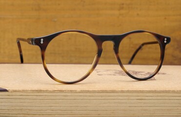 Old reading glasses on a book