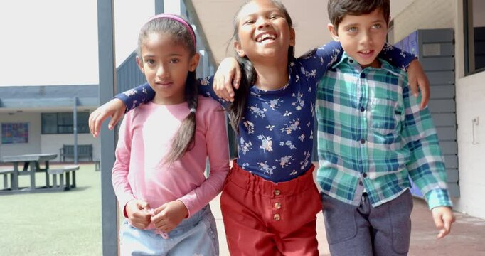 In school, group of children walking together and smiling during recess