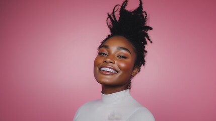 portrait shot of a sophisticated woman smiling with a transparent aligner for orthodontic correction. 
