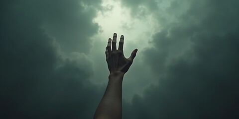 Outstretched hand reaching towards cloudy sky, dramatic lighting, hopeful gesture, spirituality, freedom, desire.