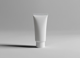 Photo of a white tube mockup for face cream, centered on a flat surface with a plain background. 