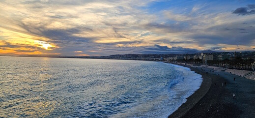 Nice,  Cote d'Azur, France -  Sunset on the Promenade des Anglais, sea, sky, romantic setting sun. French Riviera
