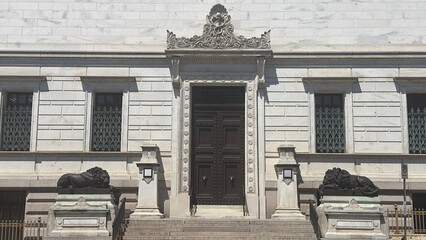  Arts and Design Building with the Statue of Lions outside in Washington DC.
