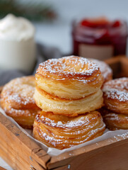 Golden Puff Pastries with Powdered Sugar in Rustic Wooden Box