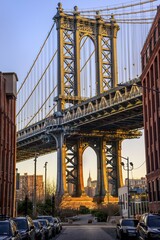 Fototapeta premium View from Main Street to Manhattan Bridge and Empire State Building, with morning sun, Dumbo, Brooklyn, New York, USA, North America