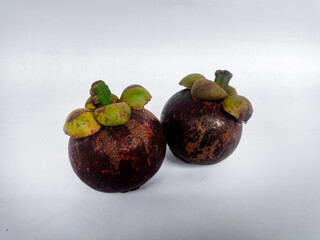 The fruit of Mangosteen or Garcinia mangostana or purple is sweet and sour, juicy, somewhat fibrous, with vesicles filled with liquid (like the flesh of citrus fruits).