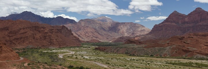 Green valley with river, red-coloured mountains, Departamento Guachipas, Province of Salta, Argentina, South America
