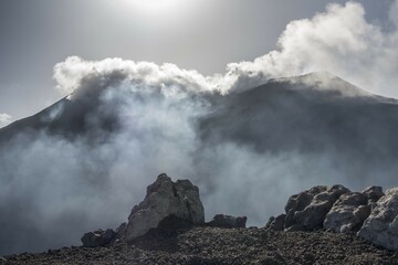 Fuming east crater in backlight, view from Rocca della Valle lookout point, Mount Etna, volcano, northeast flank, Sicily, Italy, Europe