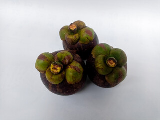 The fruit of Mangosteen or Garcinia mangostana or purple is sweet and sour, juicy, somewhat fibrous, with vesicles filled with liquid (like the flesh of citrus fruits).