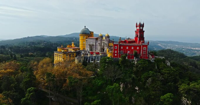 Vibrant Autumn Scene Of Pena Palace Historical Medieval Castle On High Hill Overlooking Sintra Town Province Aerial Descend Tilt Up