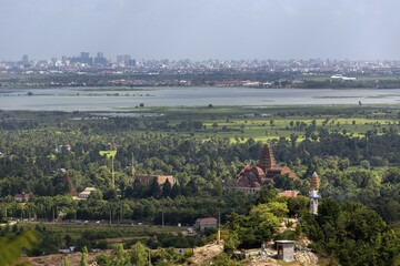 Tower of Wat Prasat Sowann Thamareach temple, rear skyline of Phnom Penh, Cambodia, Asia