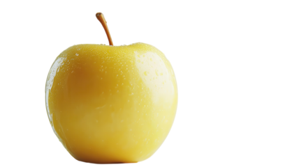 Fresh yellow apple standing upright on a clean white surface with water droplets visible