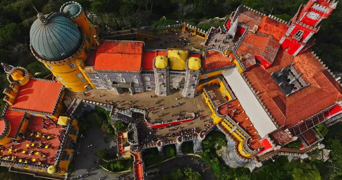 Sintra Iconic Medieval Pena Palace On Hill Top Vibrant Colorful Architecture Portugal Aerial Cinematic Zoom In