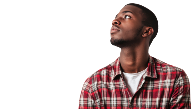 Man gazes thoughtfully upward in a studio setting with neutral background during a modeling session