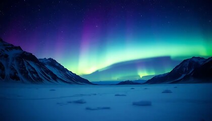 Aurora Borealis illuminates snowy mountainscape at night